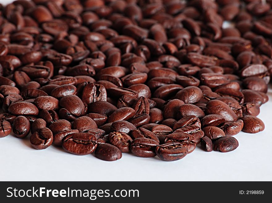 Handful of brown coffee beans for decoration