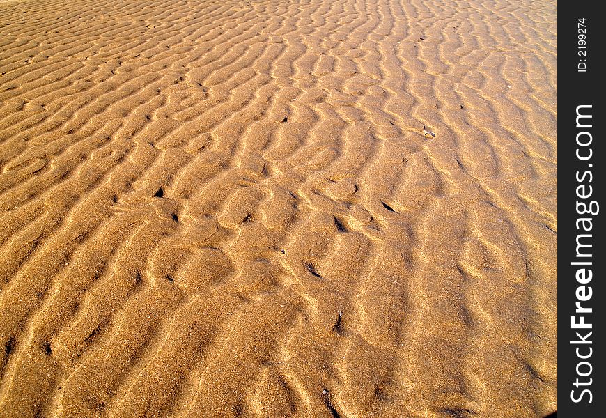 An image of Sand background with wave patterns