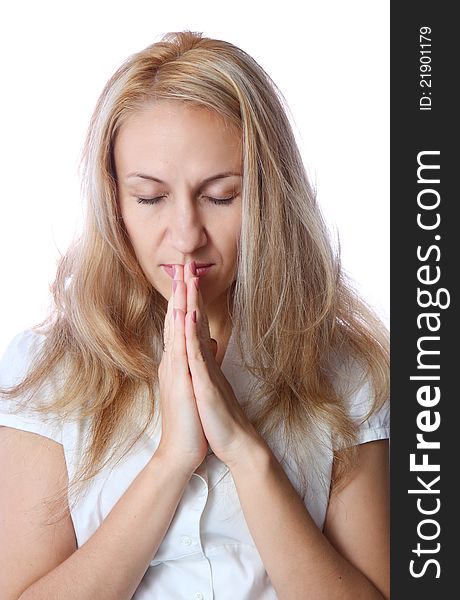 Closeup portrait of a young caucasian woman praying