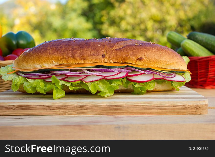 Vegetarian sandwich on the wooden table