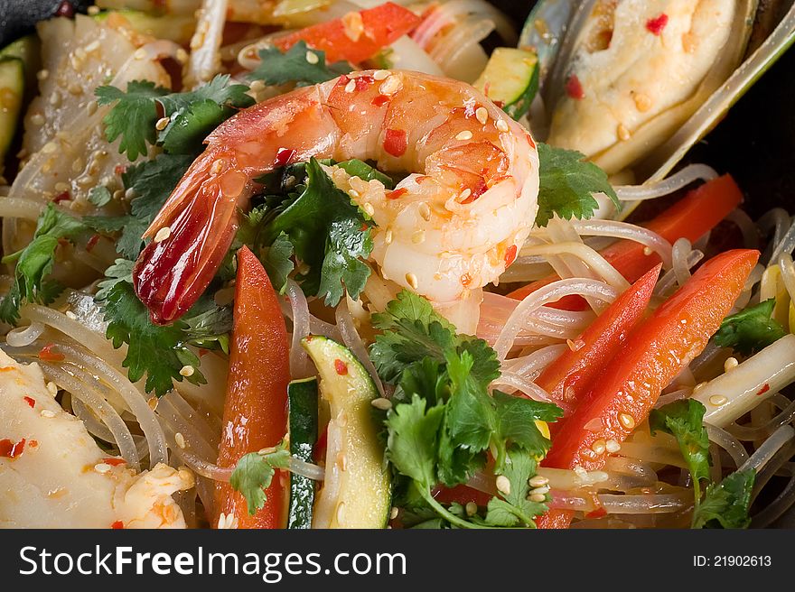 Shrimp, seafood, vegetables and rice noodles. background