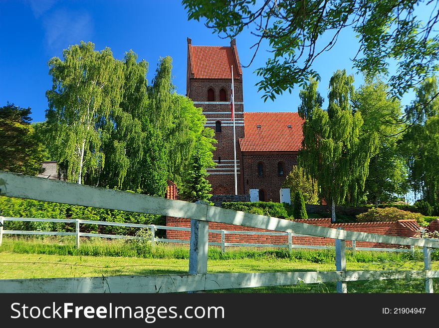 Traditional church surrounded by trees in Denmark. Traditional church surrounded by trees in Denmark