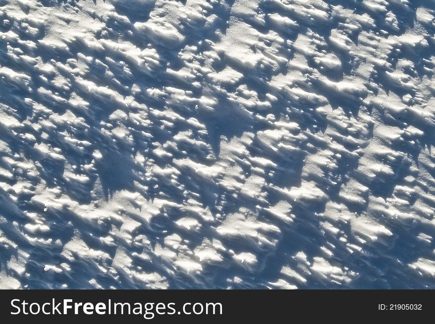 Abstract winter texture of light and shadows in snow. Abstract winter texture of light and shadows in snow