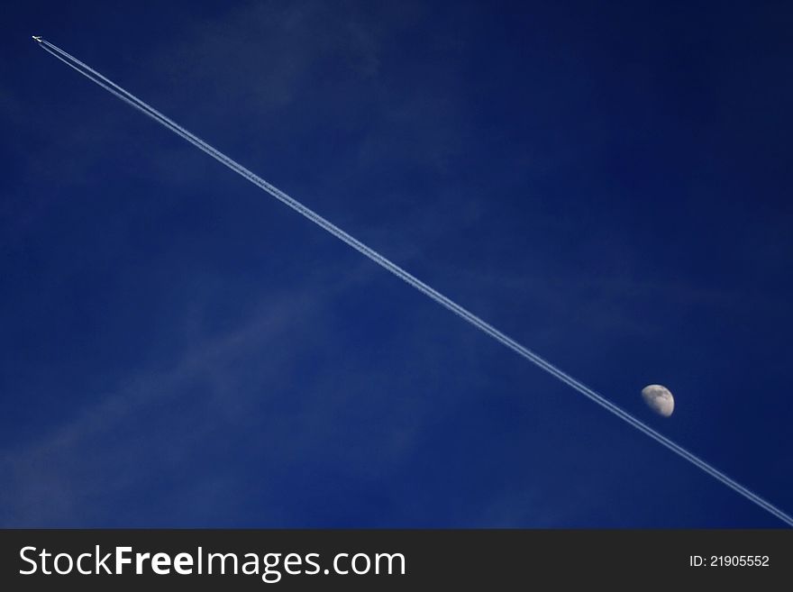 Contrail Of Jet And Moon
