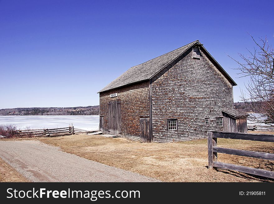 An original pioneer barn situated on the bank of the St. John River in the historic village of Kings Landing, New Brunswick. An original pioneer barn situated on the bank of the St. John River in the historic village of Kings Landing, New Brunswick