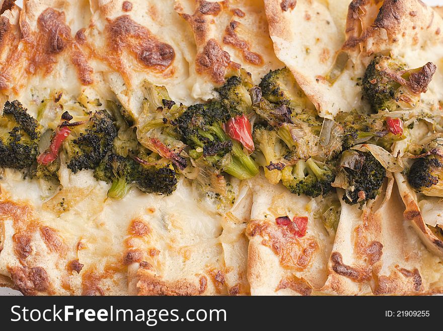 Pancakes filled with vegetables, broccoli and onion, pepper. Pancakes filled with vegetables, broccoli and onion, pepper