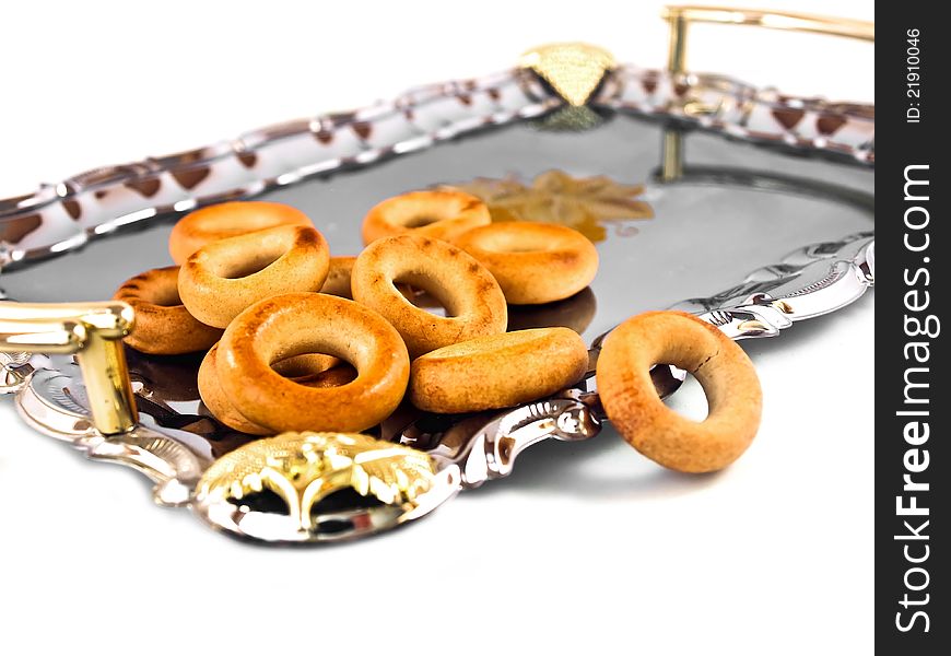 Russian sushki on a silver tray on a white background. Traditional russian food