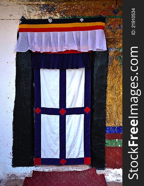 Traditional Tibetan style entrance to a house in the village of Namche Bazar in the Nepalese Himalayas. Traditional Tibetan style entrance to a house in the village of Namche Bazar in the Nepalese Himalayas