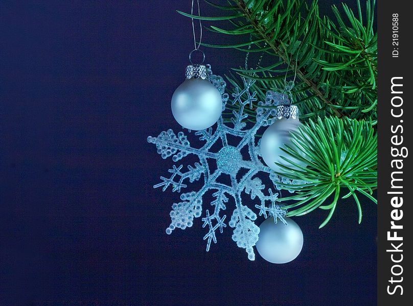 Christmas decoration with a spruce twig and silver bauble