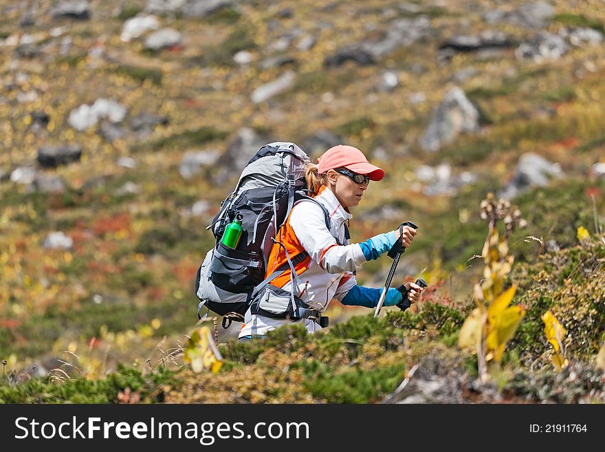 Young woman hiker hiking in Himalaya Mountains in Nepal. Young woman hiker hiking in Himalaya Mountains in Nepal
