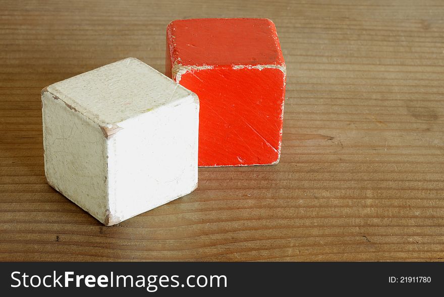 Wooden cubes colored red and white. Wooden cubes colored red and white