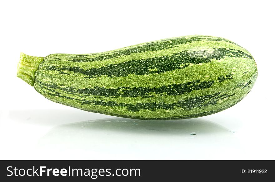 Green zucchini on a white background. Green zucchini on a white background