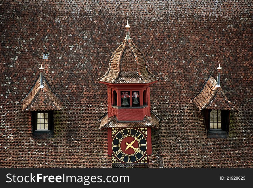 A clock on the roof of old building. A clock on the roof of old building