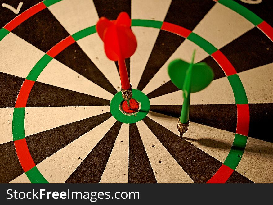 Photography of darts with dartboard