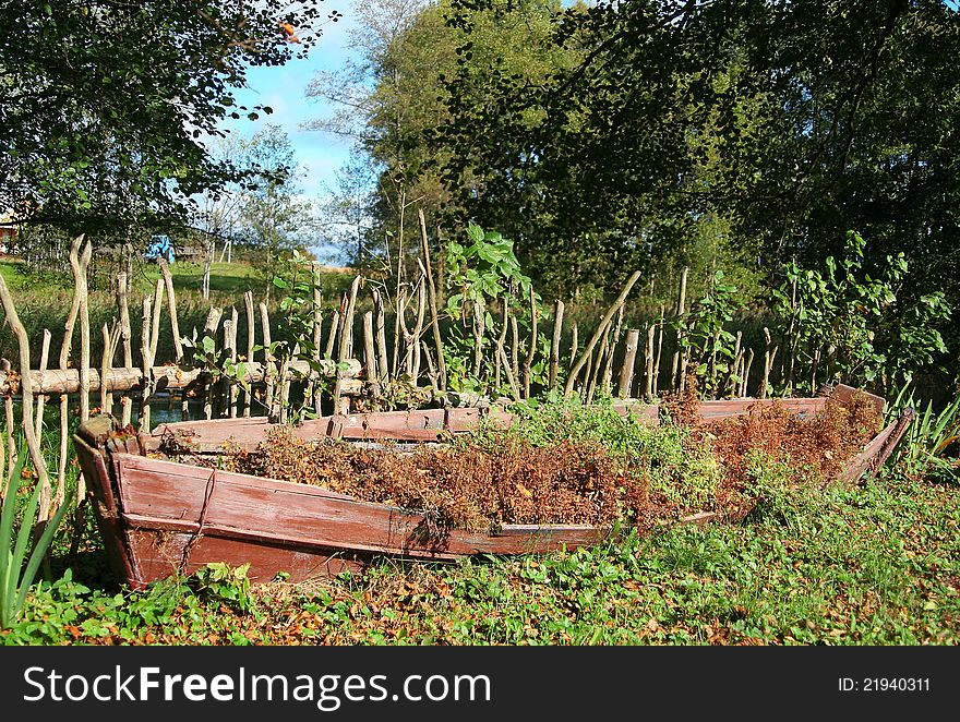 The old boat, as an element of landscape design, which lies on the banks of the River