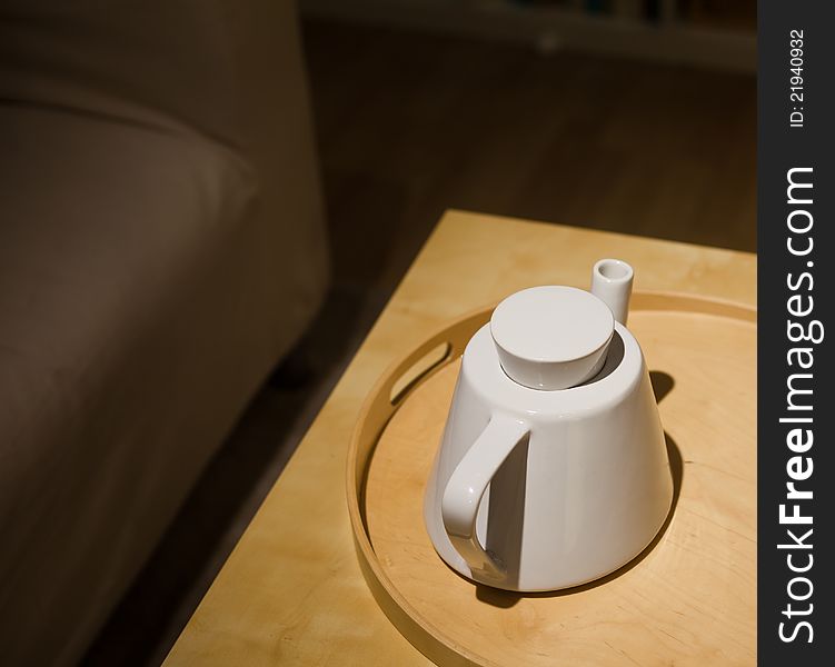 A porcelain tea pot on table