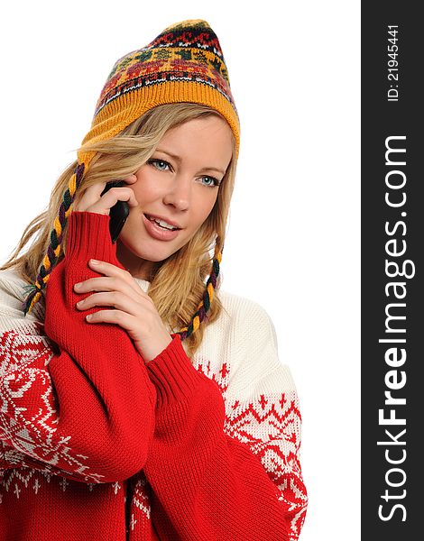 Young Woman wearing winter attire on the cell phone isolated on a white background. Young Woman wearing winter attire on the cell phone isolated on a white background