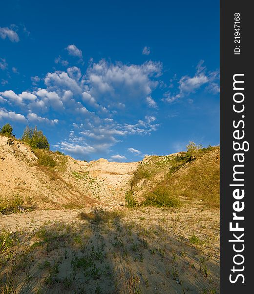 Rocky landscape with blue sky and clouds. Rocky landscape with blue sky and clouds