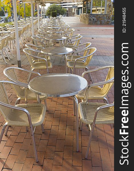 View of tables and chairs in a terrace of a bar