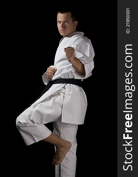 Contrast karate young male fighter black. Contrast karate young male fighter black