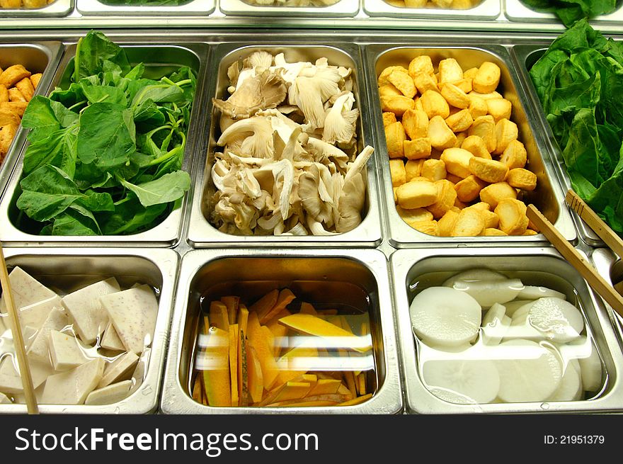 Various types of vegetables put in trays at salad bar in famous restaurant. Various types of vegetables put in trays at salad bar in famous restaurant.