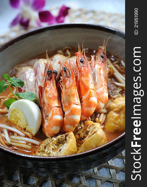 Curry laksa noodle with herbs background. Curry laksa noodle with herbs background