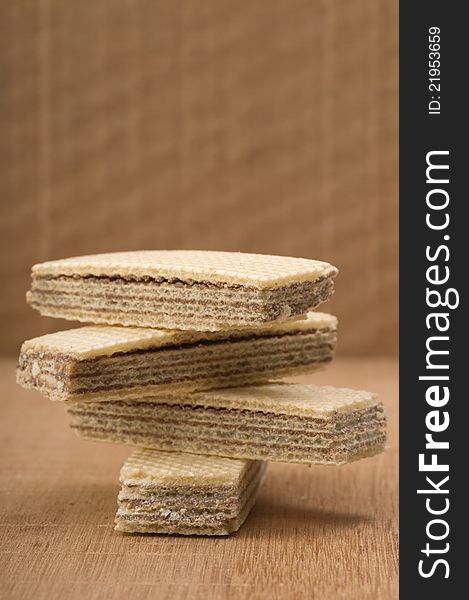 Chocolate wafer stacked and shot in the studio on wooden background