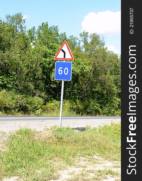 Curved Road Traffic Sign on a a road. Curved Road Traffic Sign on a a road