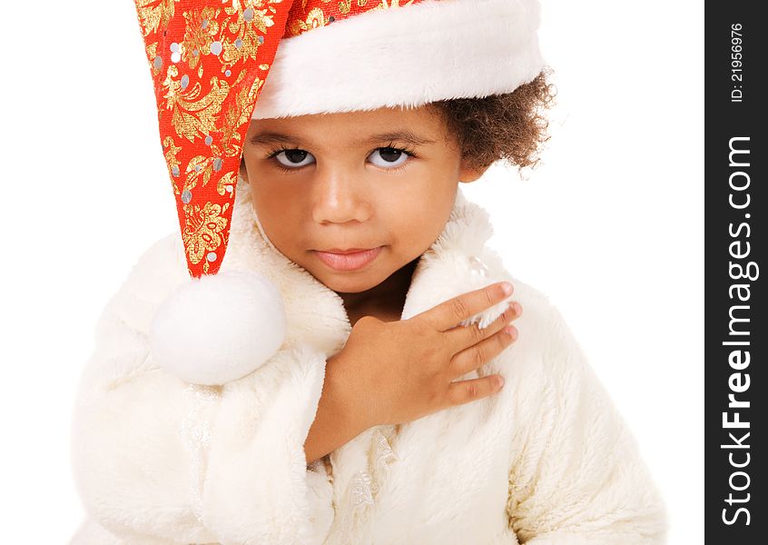 Portrait of a cute baby in Christmas hat and fur on white background. Portrait of a cute baby in Christmas hat and fur on white background