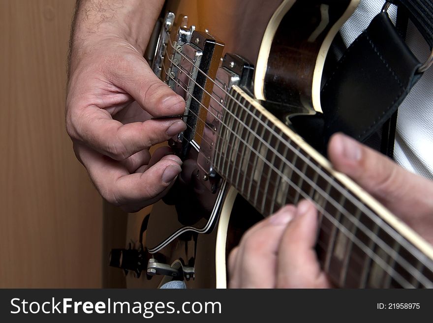 Close up of an electric guitar being played