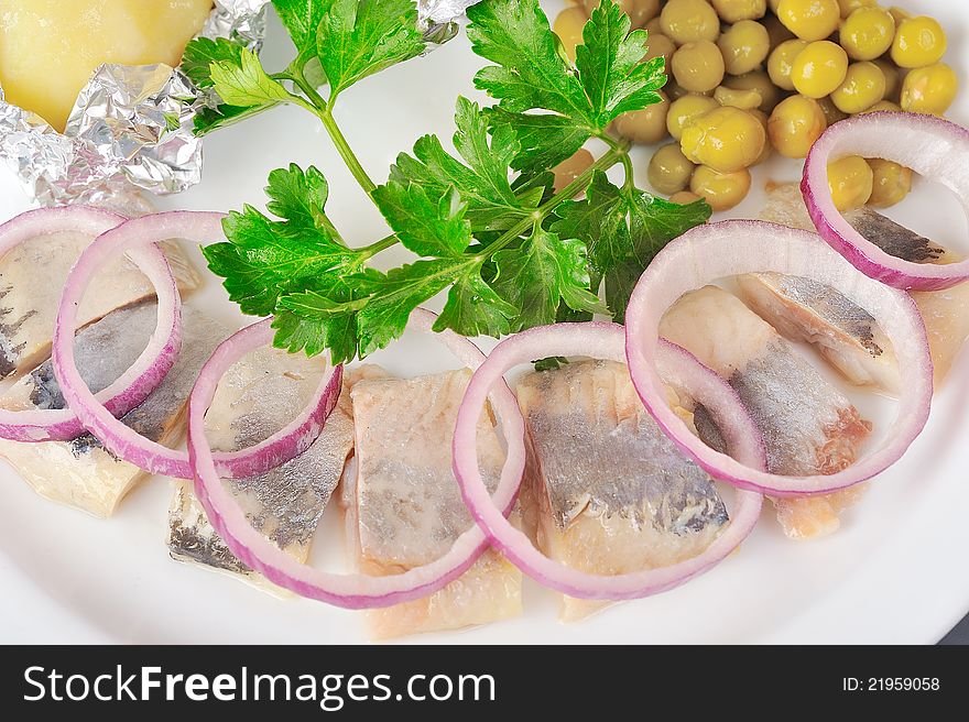 Chopped boiled vegetables with herring on plate. Chopped boiled vegetables with herring on plate