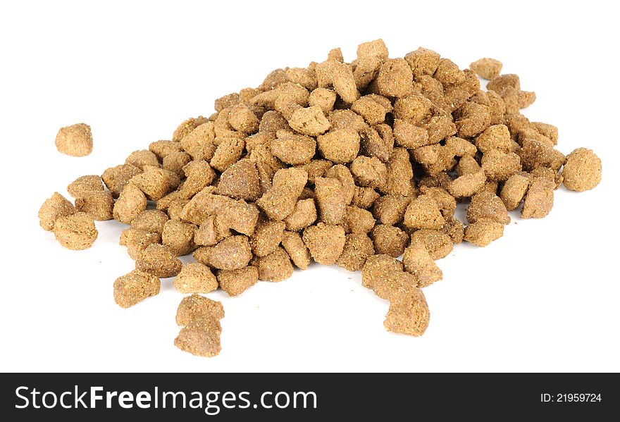 A pile of dry cat food on a white background