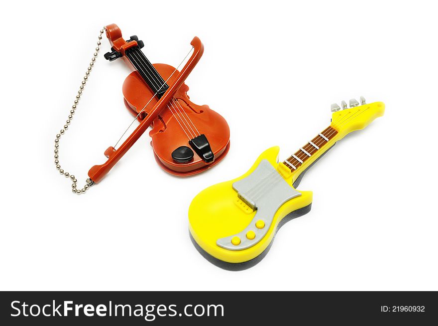 Small music toys, violin and electronic guitar. Small music toys, violin and electronic guitar