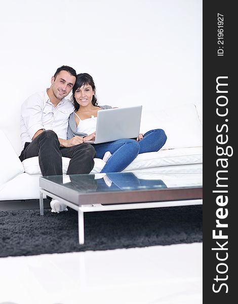 Happy young couple relax at modern home living room indoor. Happy young couple relax at modern home living room indoor