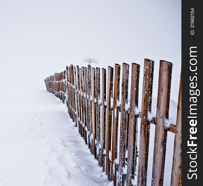 Lonely frozen fence on mountain in Iceland.