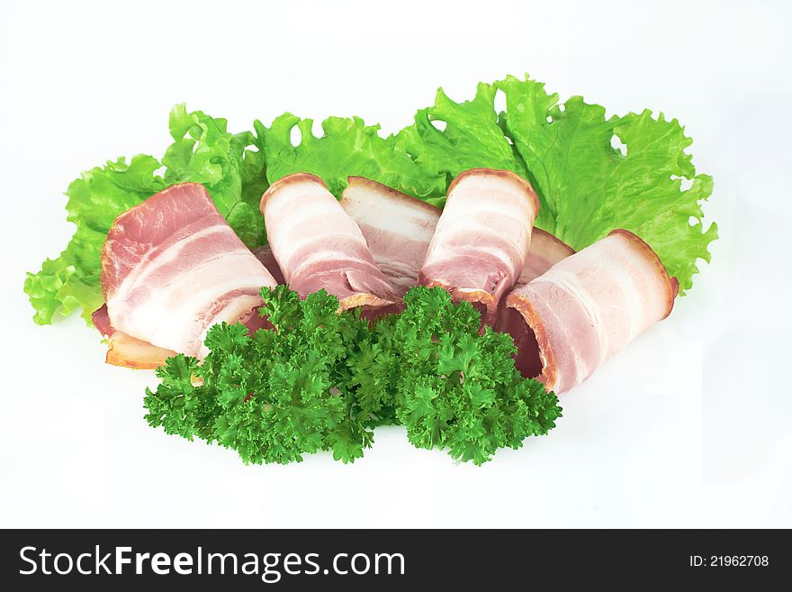 Tasty sliced bacon with parsley on white background