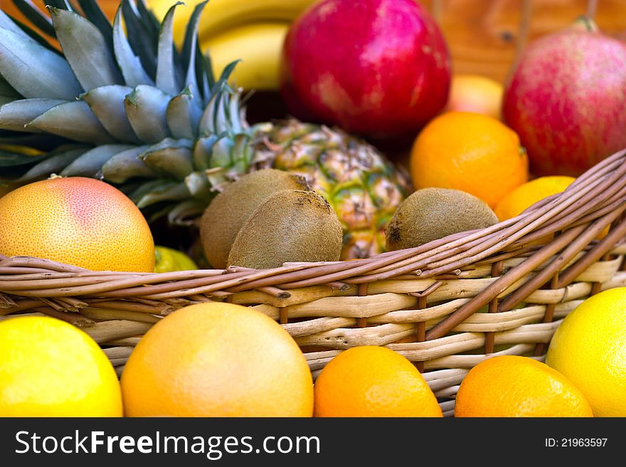Fresh fruit in wicker basked and behind. Fresh fruit in wicker basked and behind