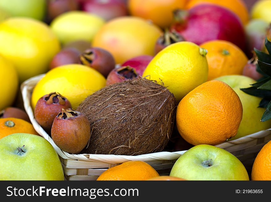 Fresh fruit in wicker basket on table. Fresh fruit in wicker basket on table