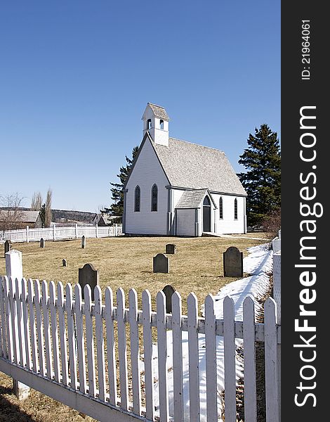 A small church and cemetery in the historic loyalist village of Kings Landing in New Brunswick, Canada. A small church and cemetery in the historic loyalist village of Kings Landing in New Brunswick, Canada