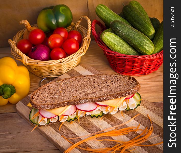 Chicken breast sandwich on the wooden table. Chicken breast sandwich on the wooden table