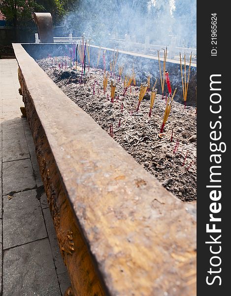 The burning joss sticks in the temple