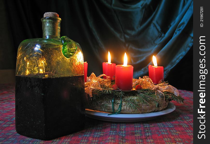 Candles give a homely glow while the bottle promises a different kind of warmth on a dark Christmas eve. Candles give a homely glow while the bottle promises a different kind of warmth on a dark Christmas eve
