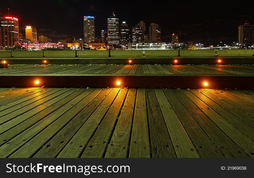 Southbank Boardwalk looking across to Brisbane City at night. Southbank Boardwalk looking across to Brisbane City at night