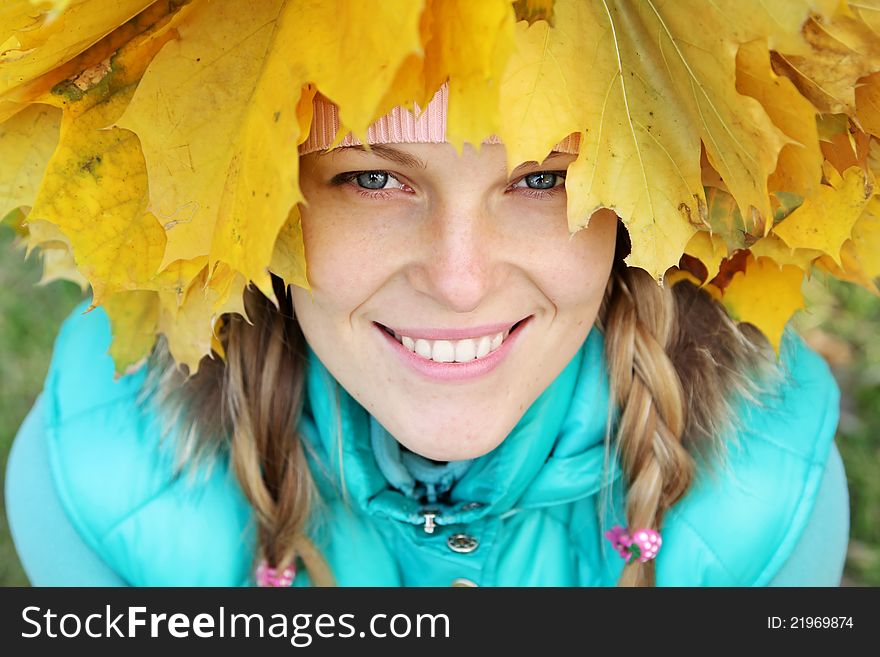 Beautiful woman wearing a crown of leaves. Beautiful woman wearing a crown of leaves