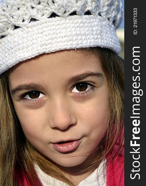 Little girl with white cap