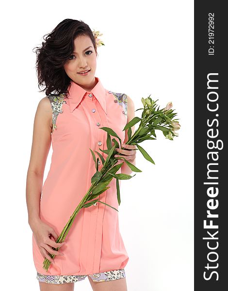 Woman and flower in white background with pink dress. Woman and flower in white background with pink dress.