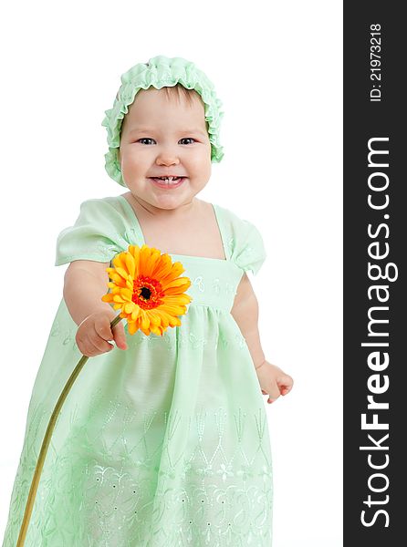 Cute little girl with flower gift on white