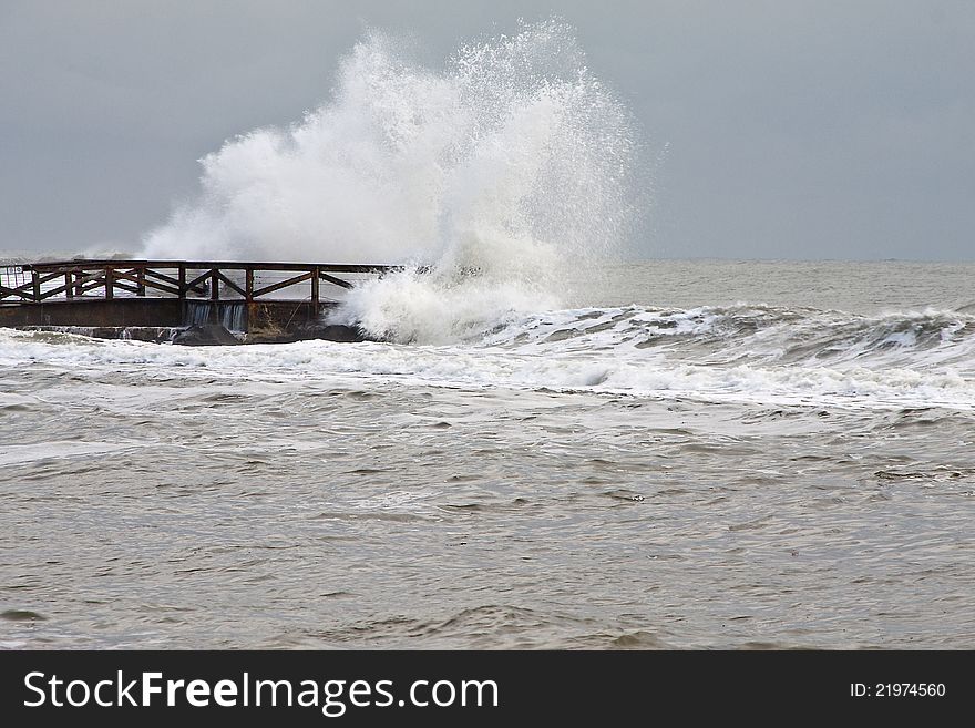 Wave that breaks on the pier. Wave that breaks on the pier