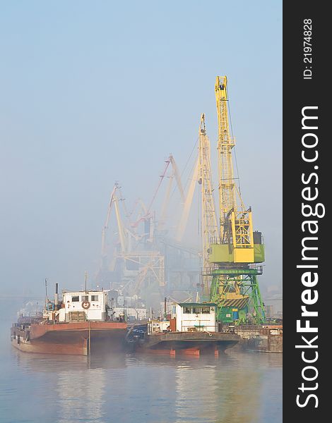 Dock on Dnieper river in fog