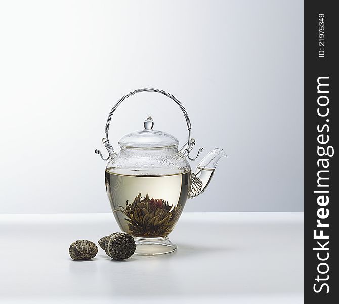 A glass teapot with Lotus Flower Chinese tea,. A glass teapot with Lotus Flower Chinese tea,